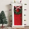 Standing miniature dimensional door surrounded with “lights” and tiny faux wreath with bow allows special entry for fairies and elves