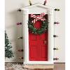Standing miniature dimensional door surrounded with “lights” and tiny faux wreath with bow allows special entry for fairies and elves